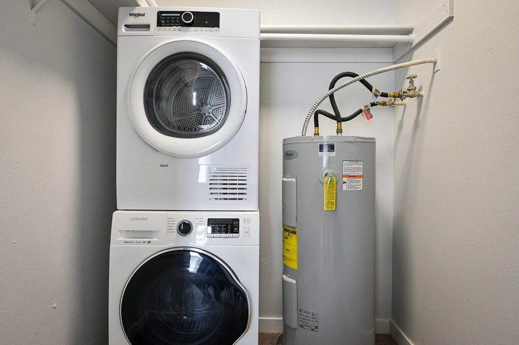 a washing machine and a dryer in a laundry room